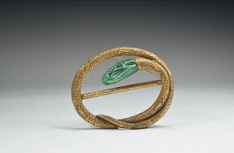 A vintage gold tone snake brooch.